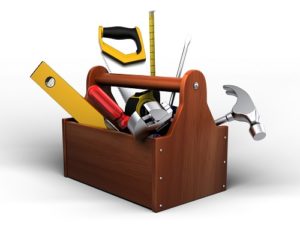 Toolbox with tools. Skrewdriver, hammer, handsaw and wrench.